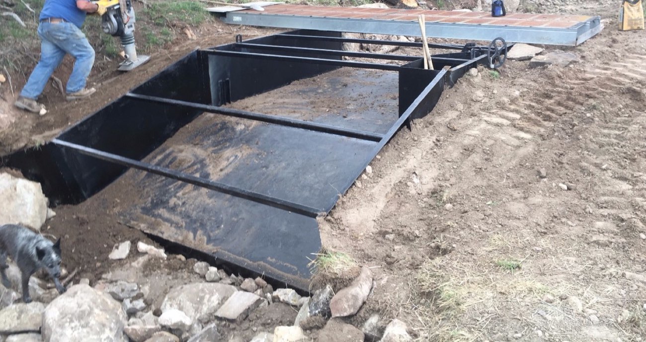 A custom steel headgate and water-control structure, fabricated and set in place by Ag-Fab