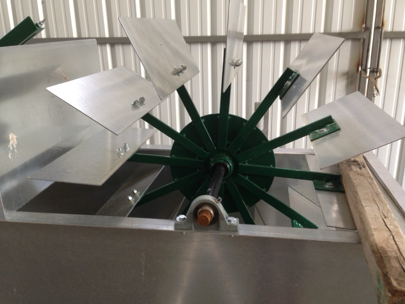 Aluminum paddles and a fabricated hub for a mechanical water cleaner, under construction in the Ag-Fab shop